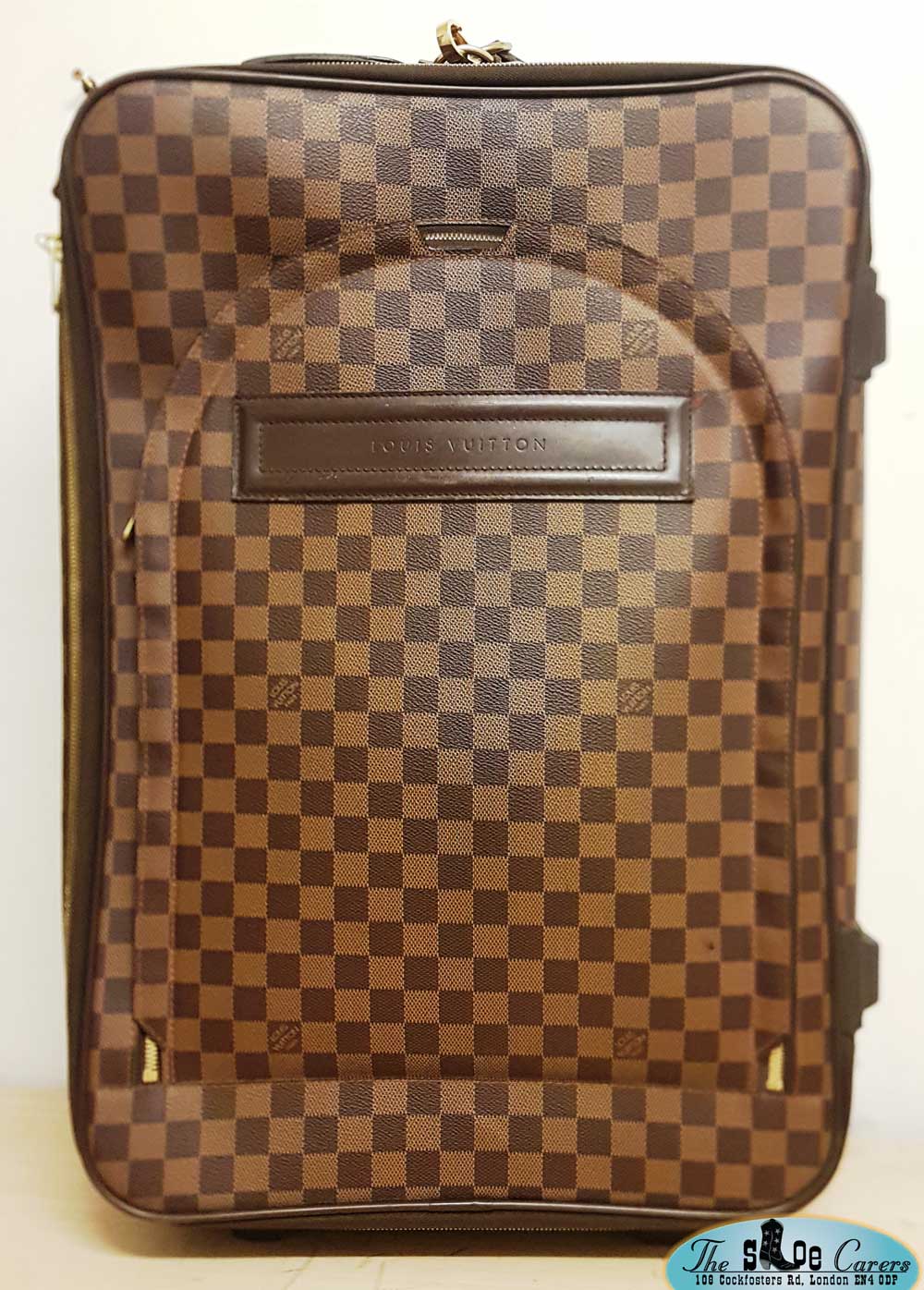 Louis Vuitton suitcase wheel re-rubbering – The Shoe Carers